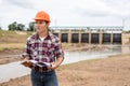 Young engineer working on site at the dam Royalty Free Stock Photo