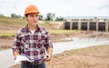 Young engineer working on site at the dam Royalty Free Stock Photo