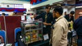 Young engineering student presenting his product at the Final Year Project exhibition event in UniKL MFI Royalty Free Stock Photo