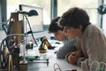 Young engineering students using a 3D printer Royalty Free Stock Photo