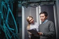 Young engineers businessmen in server room