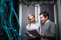 Young engineers businessmen in server room