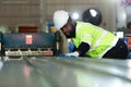 Young engineers engineers testing and confirming that the machinery at the factory