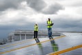Young Engineers and Specialist Technicians Check Quality of Installing Solar Photovoltaic Panels and Use App Technology Checking