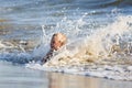 Young enjoy sea weaves at the sandy beach