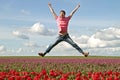 Young enthousiastic guy jumping up Royalty Free Stock Photo