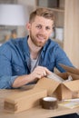young entrepreneur preparing package for shipment Royalty Free Stock Photo