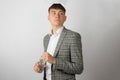 Young entrepreneur wearing a suit jacket and open neck shirt Royalty Free Stock Photo