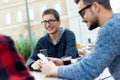 Young entrepreneurs working at coffee bar. Royalty Free Stock Photo