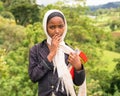 Young ethiopian schoolgirl carrying her exercise books