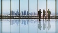 Young european business people working in modern office interior with panoramic city view. Meeting, success, teamwork and Royalty Free Stock Photo