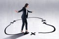 Young european businesswoman with arrows walking in circles on concrete background. Success, leadership, choice, loop and