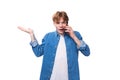 young european guy with golden hair speaks on the phone Royalty Free Stock Photo