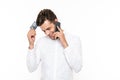 Young european guy with short dark hair talking on smartphone an Royalty Free Stock Photo