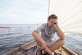 Young european man having a nausea seasickness. He is trying to stop vomiting.