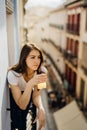 Young european woman spending spa free time home.Self care,staying home.Enjoying view on the balcony.Relaxing at home.Hotel room Royalty Free Stock Photo