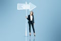 Young woman thinking which path to choose on blue background with sign sketch. Different direction concept