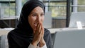 Young excited arab woman checking email on laptop concentration reading gets good news amazed happy businesswoman winner Royalty Free Stock Photo