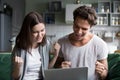 Excited couple ecstatic by online win looking at laptop screen Royalty Free Stock Photo