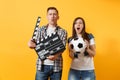 Young excited couple woman man football fans cheer up support team with soccer ball, film making clapperboard isolated Royalty Free Stock Photo