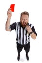 Young excited sport referee wearing field judge uniform showing red card isolated on white studio background. Concept of Royalty Free Stock Photo