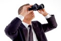 Young executive observing through binoculars Royalty Free Stock Photo