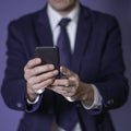 Young executive using a mobile phone. Closeup Royalty Free Stock Photo