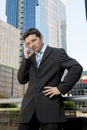 Young exhausted and worried businessman standing outdoors in stress and depression Royalty Free Stock Photo