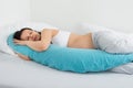 Expecting Woman Sleeping On Bed Royalty Free Stock Photo