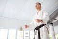 Young but experienced aikido master showing his fists