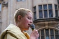 A young Extinction Rebellion activist speaks at a protest in London