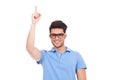 Young eyeglassed man pointing up Royalty Free Stock Photo