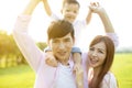 Young family with baby having fun in nature