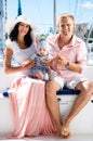 Young family with a baby on a sailing boat Royalty Free Stock Photo