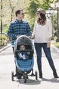 Young family with baby strollers on city walk Royalty Free Stock Photo