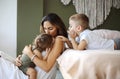 Young family beautiful mother with two son of different ages spending time at home Royalty Free Stock Photo