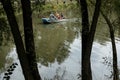 Young family boating in the park. Vacation concept with family on a boat Royalty Free Stock Photo