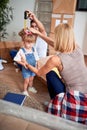 Young family after buying new house have fun with child Royalty Free Stock Photo