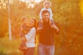 Young family with children walking in park. Father, mother and two sons Royalty Free Stock Photo