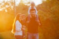 Young family with children walking in park. Father, mother and two sons Royalty Free Stock Photo