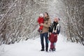 Young family with children are walking in the winter park. Winte Royalty Free Stock Photo