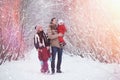 Young family with children are walking in the winter park. Winte Royalty Free Stock Photo