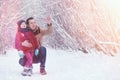 Young family with children are walking in the winter park. Winte Royalty Free Stock Photo