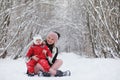 Young family with children are walking in the winter park. Winte Royalty Free Stock Photo