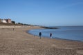 A young family on Clacton Beach in Essex in the UK