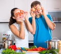 Young family couple cooking vegetables Royalty Free Stock Photo