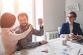 Young family couple purchase rent property real estate . Agent giving consultation to man and woman. Signing contract Royalty Free Stock Photo