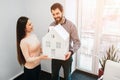 Young family couple purchase rent property real estate . Agent giving consultation to man and woman. Signing contract Royalty Free Stock Photo