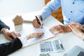 Young family couple signing home loan contract purchase agreement with property real estate agent Royalty Free Stock Photo