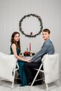 young family couple sitting on the Christmas laid table